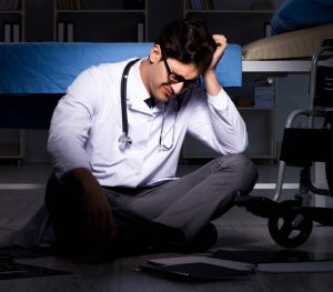 A doctor looks upset after he failed to obtain consent properly.