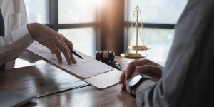 Medical negligence solicitor pointing at contract.