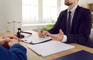 A solicitor discusses the medical negligence claims process with a client